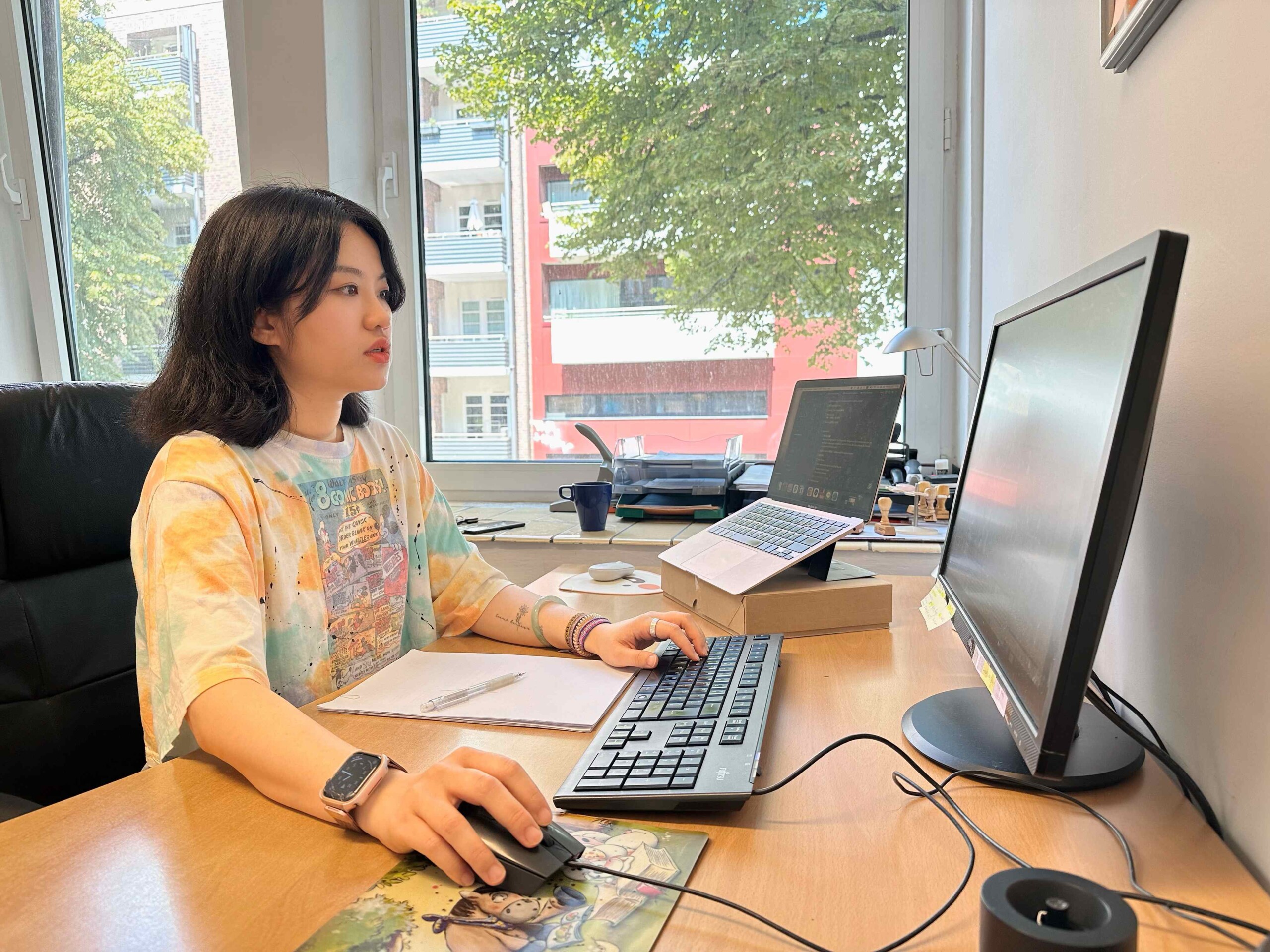 Asian woman at desk 