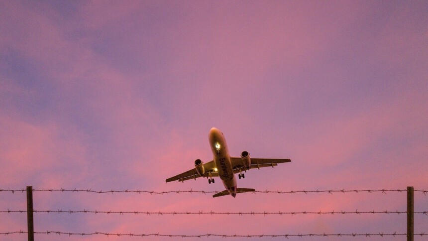 Rising airplane at sunset 